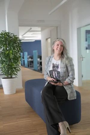 Reni Lausch lächelnd, sympathische Beraterin für effiziente Arbeitsprozesse
